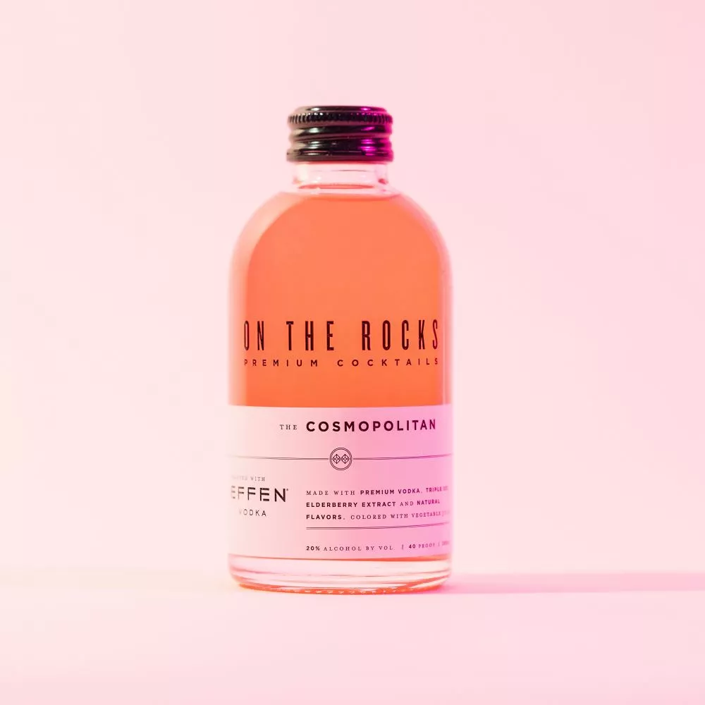 OTR Cosmopolitan cocktail bottle in orange lighting 