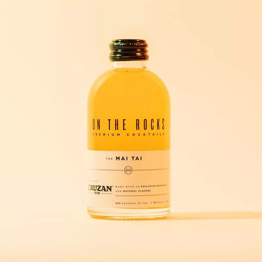 OTR Mai tai cocktail bottle in orange lighting