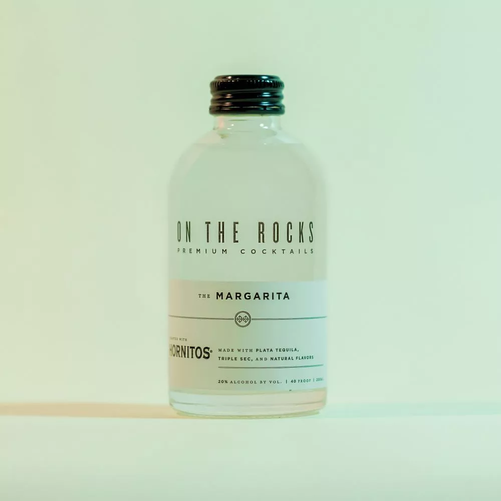 OTR Margarita cocktail bottle in green lighting 